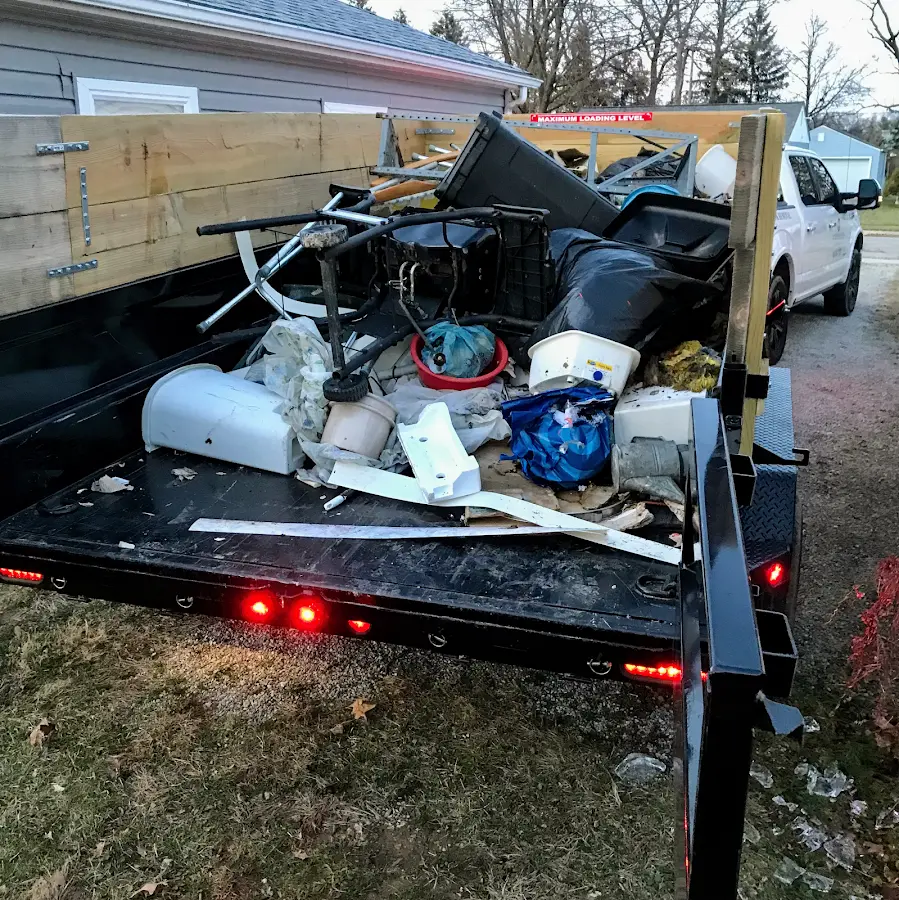 Roll-off dumpster delivered to a residential driveway in Villas